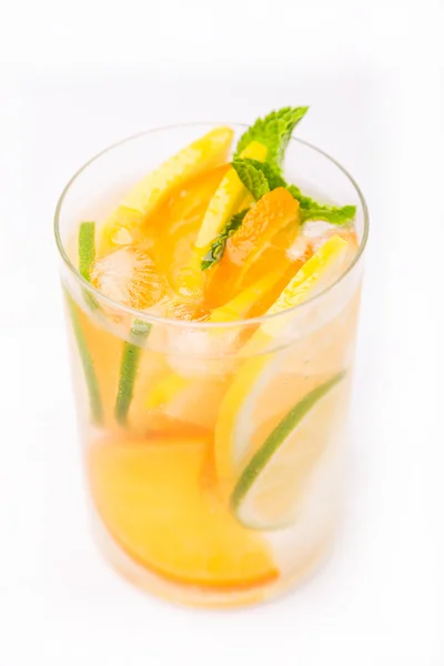 Fresh cold cocktail in glass with sliced citus — Stock Photo, Image