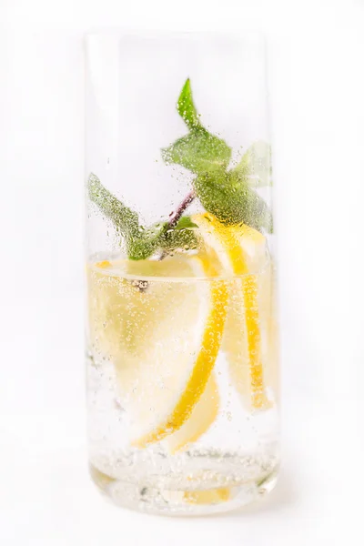 Fresh cold cocktail in glass with sliced citus — Stock Photo, Image