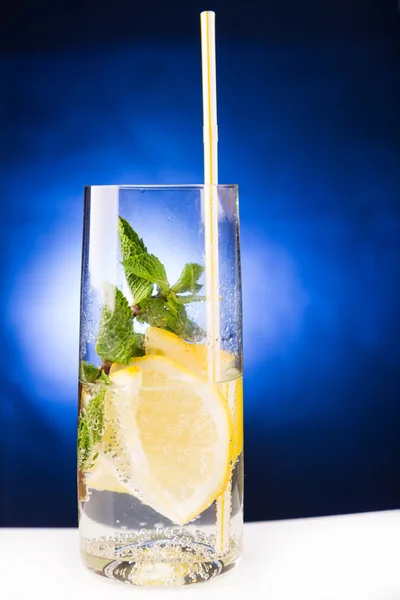 Fresh cold cocktail in glass with sliced citus — Stock Photo, Image