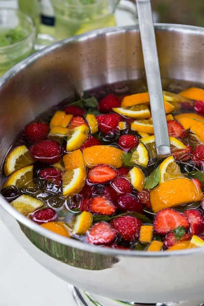 Mixed punch with fruits in metal bowl — Stock Photo, Image