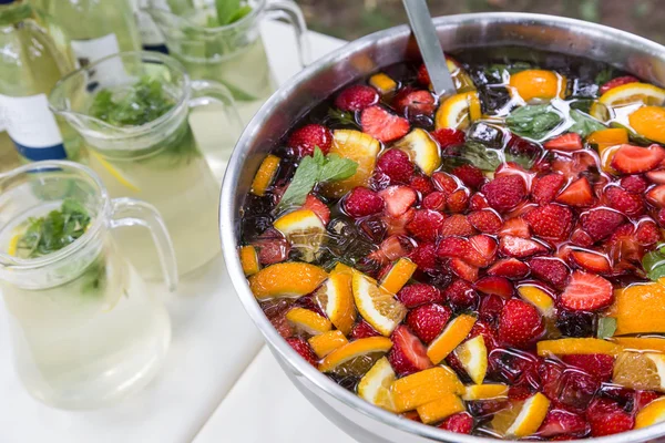Mixed punch with fruits in metal bowl — Stock Photo, Image