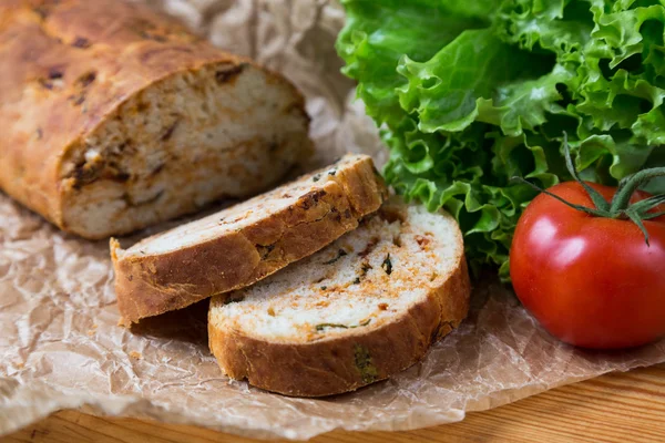 White sliced homemade baguette with dried tomatoes — Stock Photo, Image