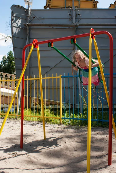 Girl swinging on a swing — Stock Photo, Image