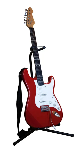 Red electric guitar on a stand — Stock Photo, Image