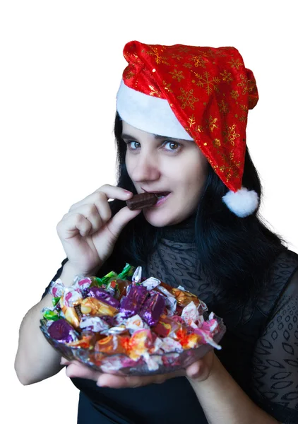 Giovane bella donna in camicetta nera con in mano un piatto di caramelle — Foto Stock