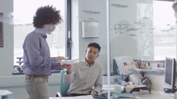 Young creative business team working together in a light contemporary office — Stock Video