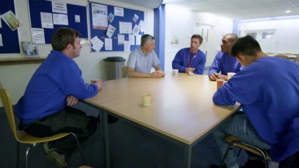 Manual workers taking a break in the company canteen — Stock Video