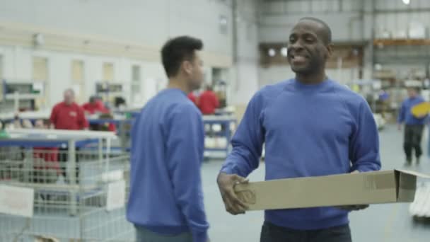 Cheerful factory or warehouse worker taking instruction from the foreman — Stock Video