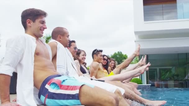 Attractive mixed ethnicity group of friends enjoying summer pool party — Stock Video