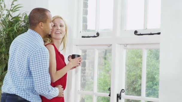 Couple looking out of window — Stock Video