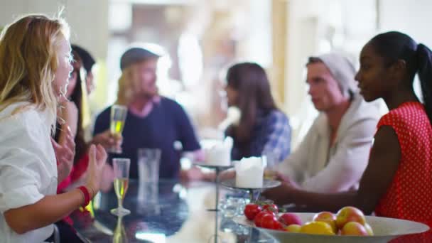 Group of friends socializing and chatting over drinks — Stock Video