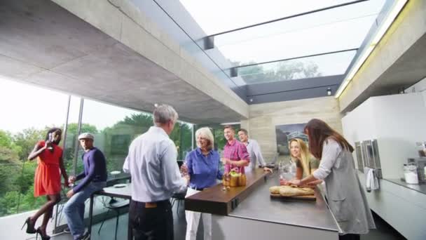 Family & friends drinking champagne in kitchen — Stock Video