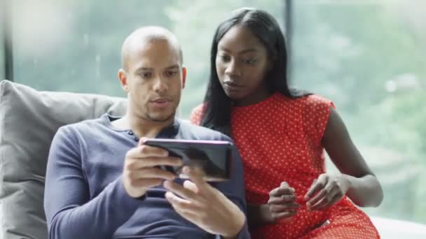 Couple with technology relaxing at home — Stock Video