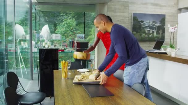 Young couple sitting down to eat — Stock Video