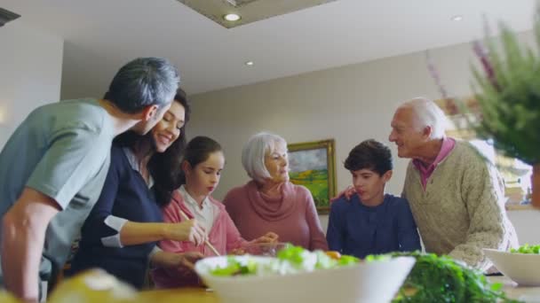 Happy family preparing meal together — Stock Video