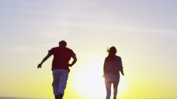 Couple running on beach — Stock Video