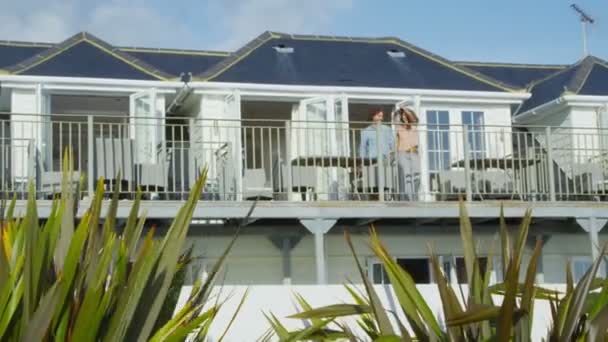 Couple go out on balcony — Stock Video