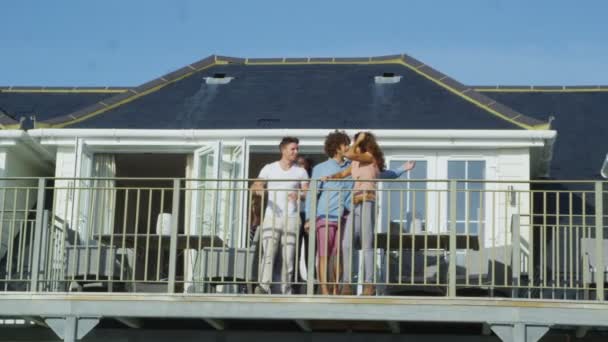 Friends on vacation go out on balcony — Stock Video