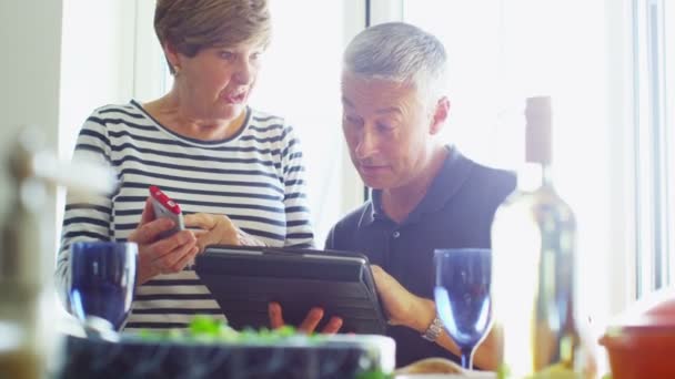 Couple with computer tablet. — Stock Video