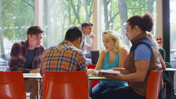 Student together in cafe area of college — Stock Video