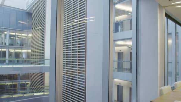 Interior view of empty meeting room in a large contemporary office building — Stock Video