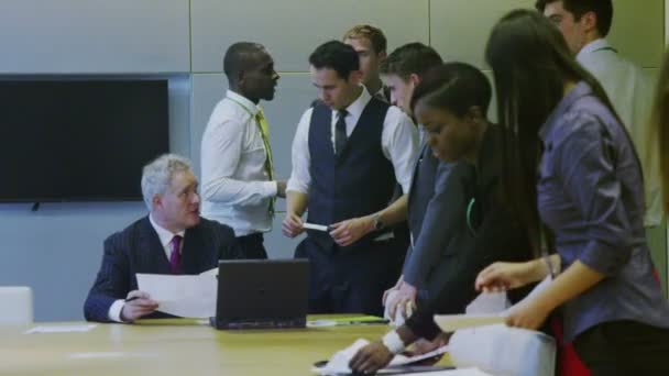 Diverse business team working together in meeting room of modern office — Stock Video