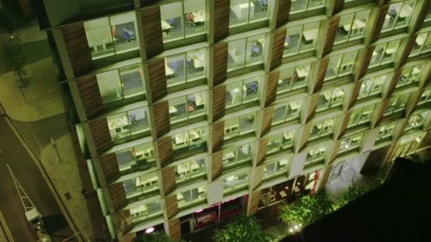 Exterior view of a London city office building at night — Stock Video