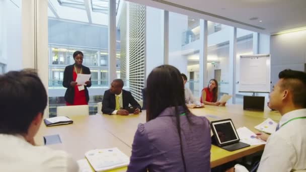 Business team in boardroom meeting in a large modern office building — Stock Video