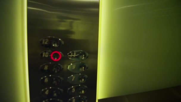 Fingers pressing the buttons in an elevator — Stock Video