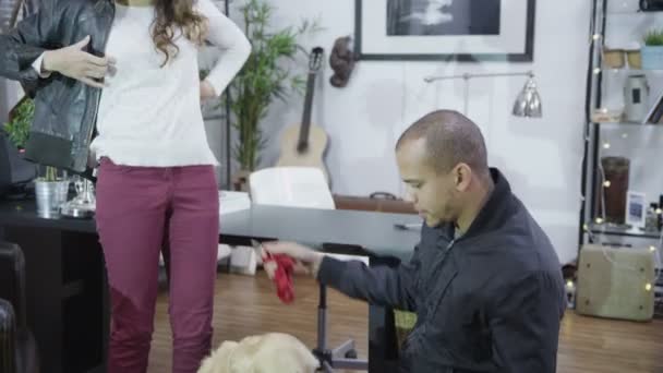 Man and woman get ready to walk dog — Stock Video