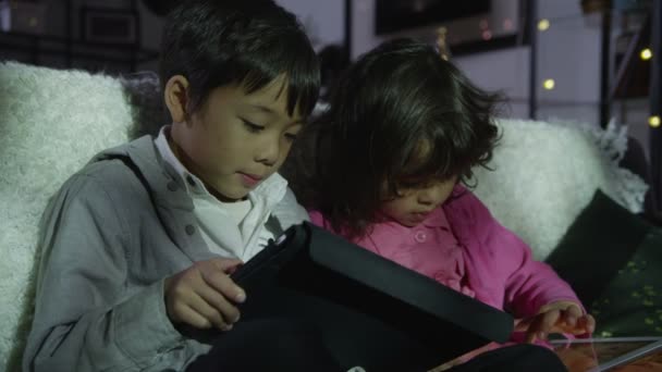 Brother and sister learning on computers — Stock Video