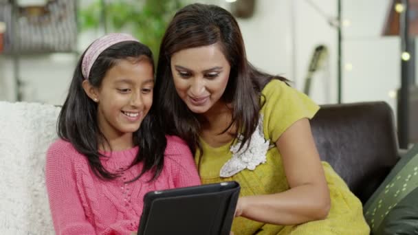 Mother and daughter spending time together and using a digital tablet — Stock Video
