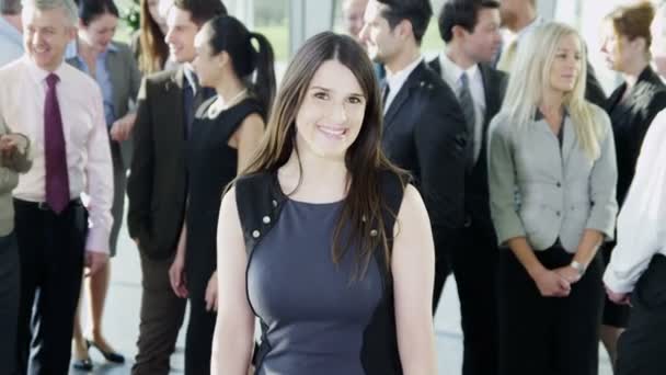 Businesswoman standing in front of business team — Stock Video