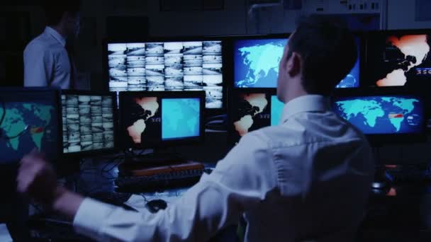 Security personnel working in system control room. — Stock Video