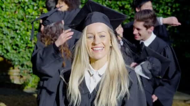 Female graduate on graduation day — Stock Video