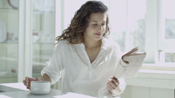 Woman relaxing by the window — Stock Video