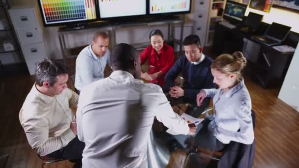 Successful and confident businessman giving a presentation to his colleagues — Stock Video