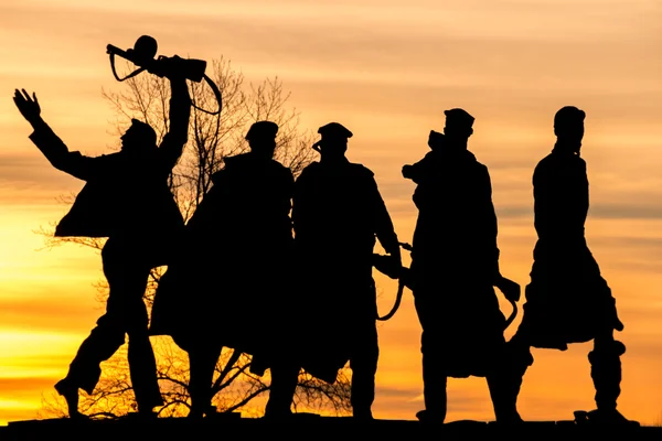 Soldiers oldiers at sunrise. — Stock Photo, Image