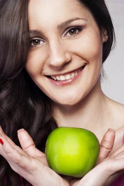 Young woman with an apple — Stock Photo, Image