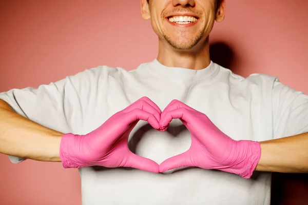 Young Doctor Protective Pink Gloves Showing Heart Symbol Man Medical — Stock Photo, Image