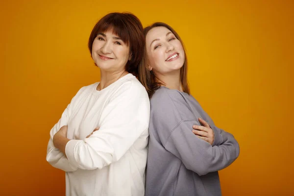 Mother Daughter Smiling Happy Standing Isolated Yellow Background Mother Day — Stock Photo, Image