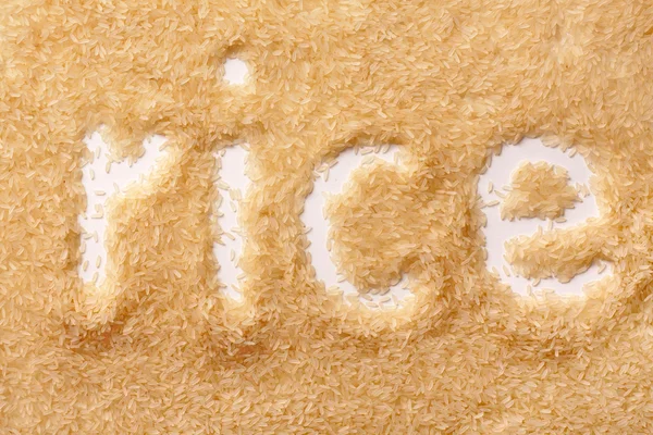 Grains of rice in the form of inscriptions — Stock Photo, Image
