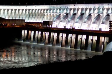 Itaipu Dam on Parana river located on the boarder between Brazil clipart