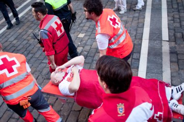 PAMPLONA, SPAIN - JULY 8: Providing first aid at San Fermin fest clipart