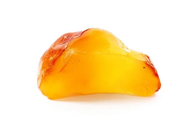 Natural amber. A piece of yellow opaque natural amber on white background. — Stock Photo, Image