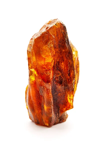 Natural amber. A piece of yellow opaque natural amber on white background. — Stock Photo, Image