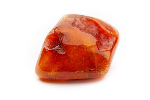 Natural amber. A piece of yellow opaque natural amber on white background. — Stock Photo, Image