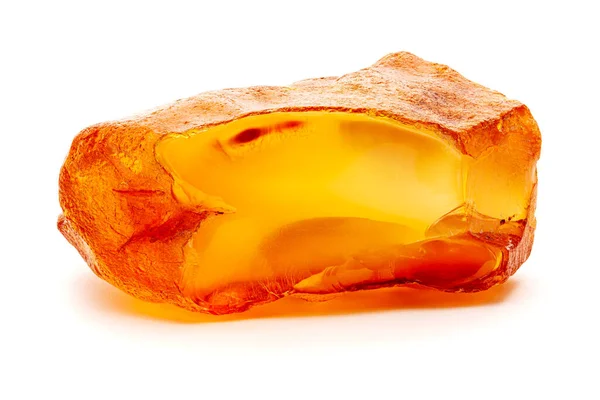 Natural amber. A piece of yellow opaque natural amber on white background. — Stock Photo, Image