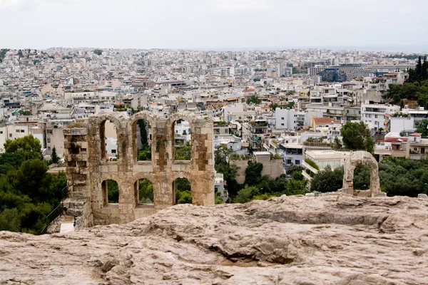 Ruins of the old city on the background of the new. Athens, Greece, Peloponnese. — Stock Photo, Image