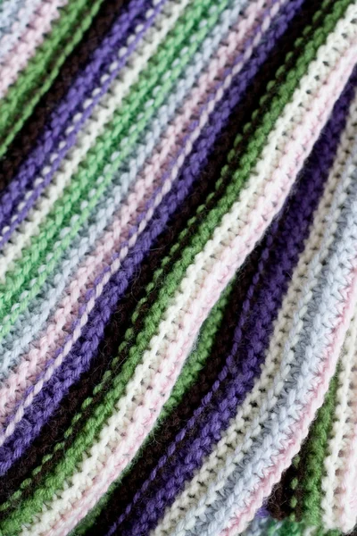 Knitting striped rug with white, purple, green and pink stripes — Stock Photo, Image